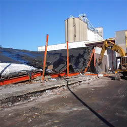 DCC performing the demolition of the Monticello IGA