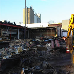 DCC performing the demolition of the Monticello IGA 